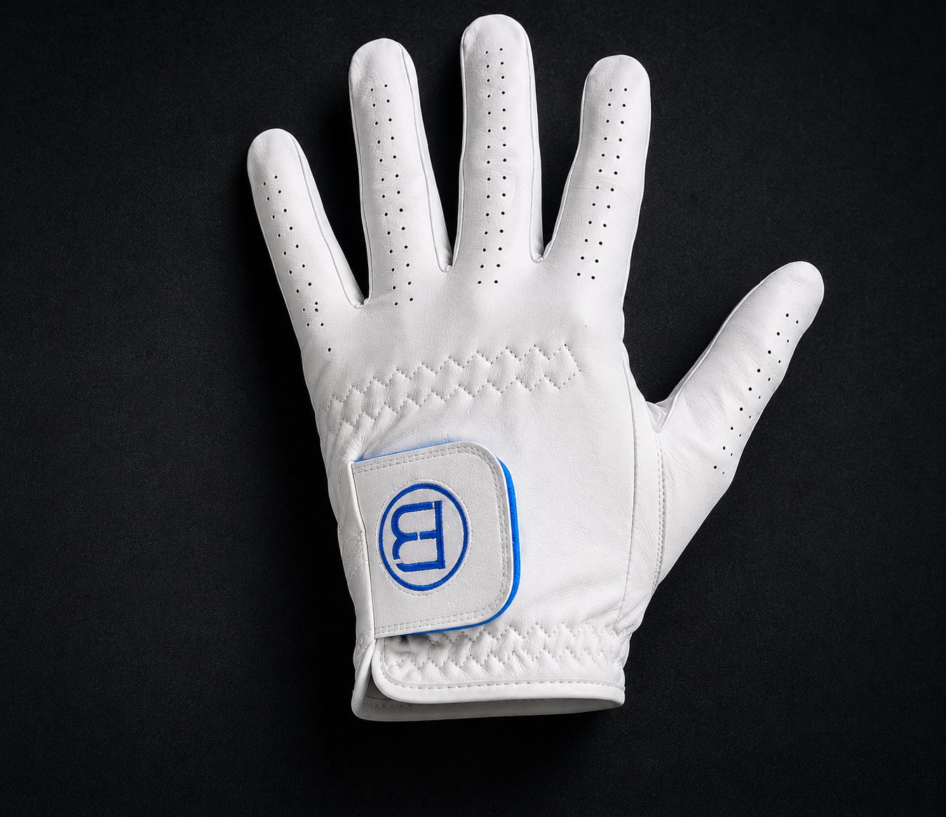 The Fore Broz Magnetic Glove — white cabretta leather with a blue magnetic cuff